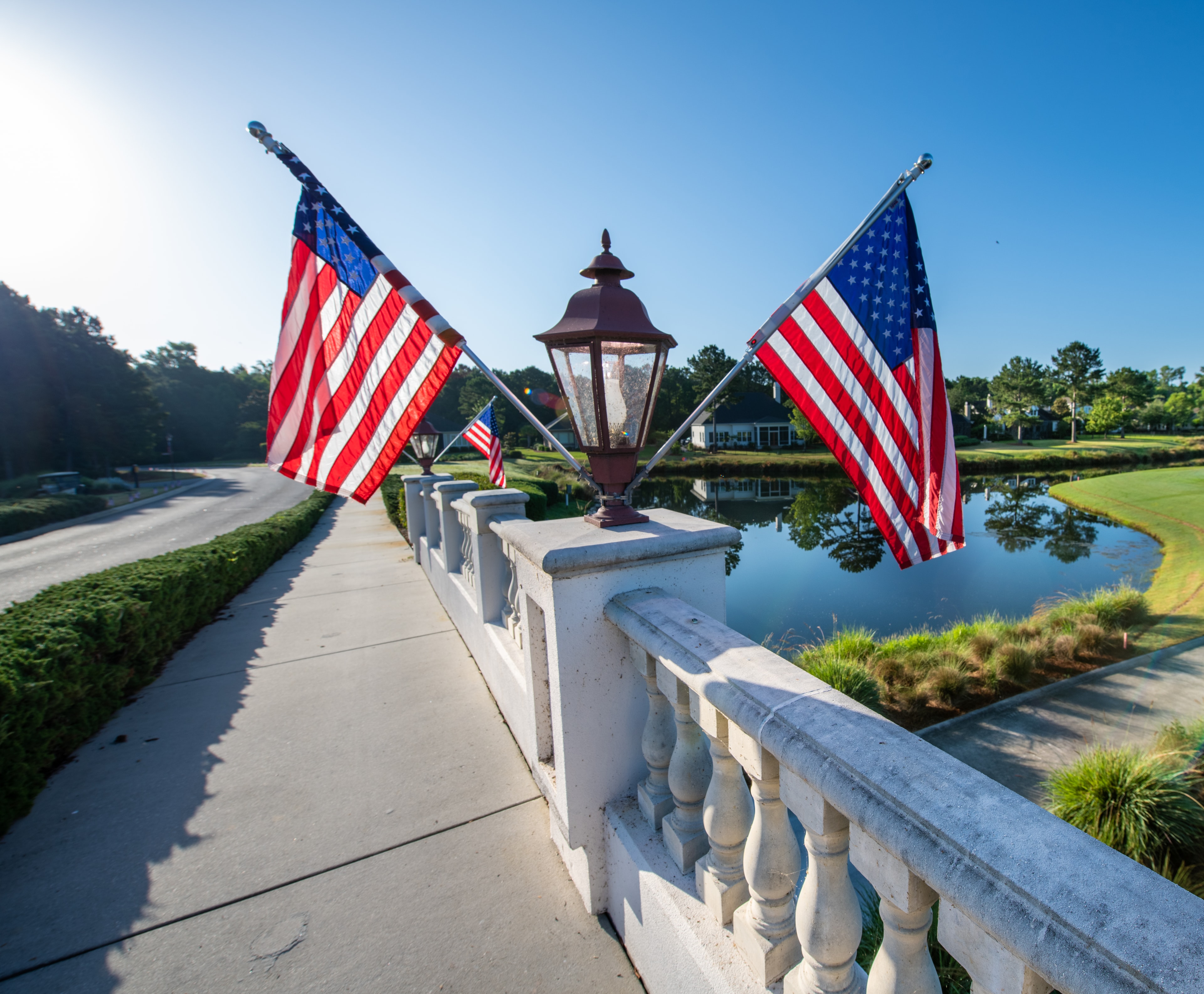 Bridge lined with American flags at the Golf Classic venue