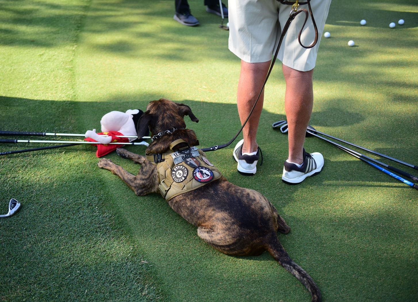 Wounded hero with service dog at the 2021 Golf Classic