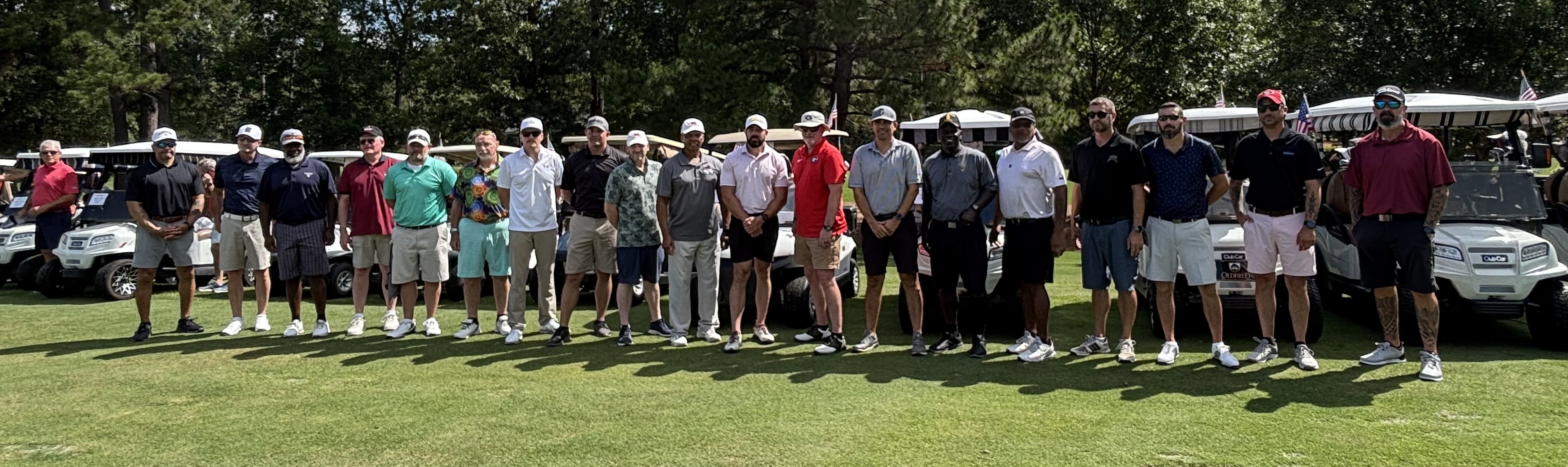 2026 Oldfield Golf Classic wounded hero guests lined up with golf carts