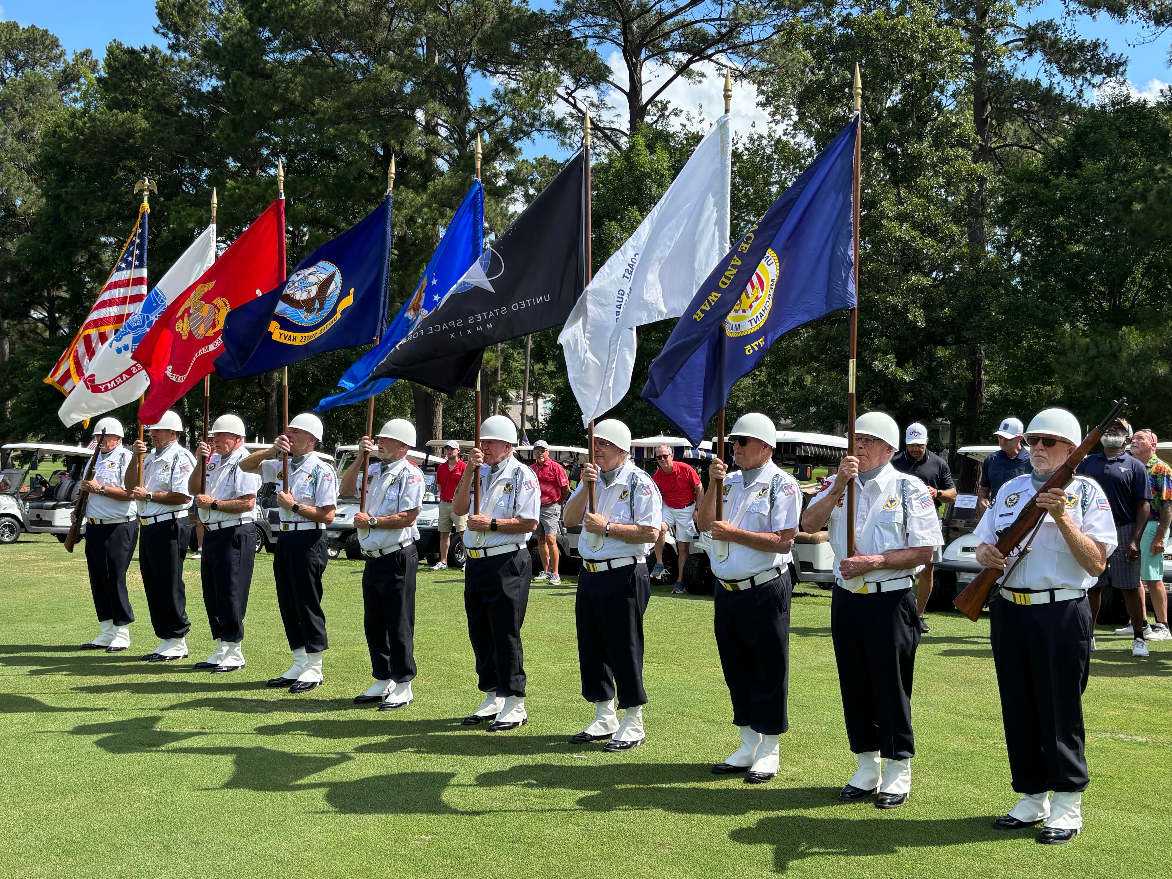 Color guard with military branch flags at the Oldfield Golf Classic