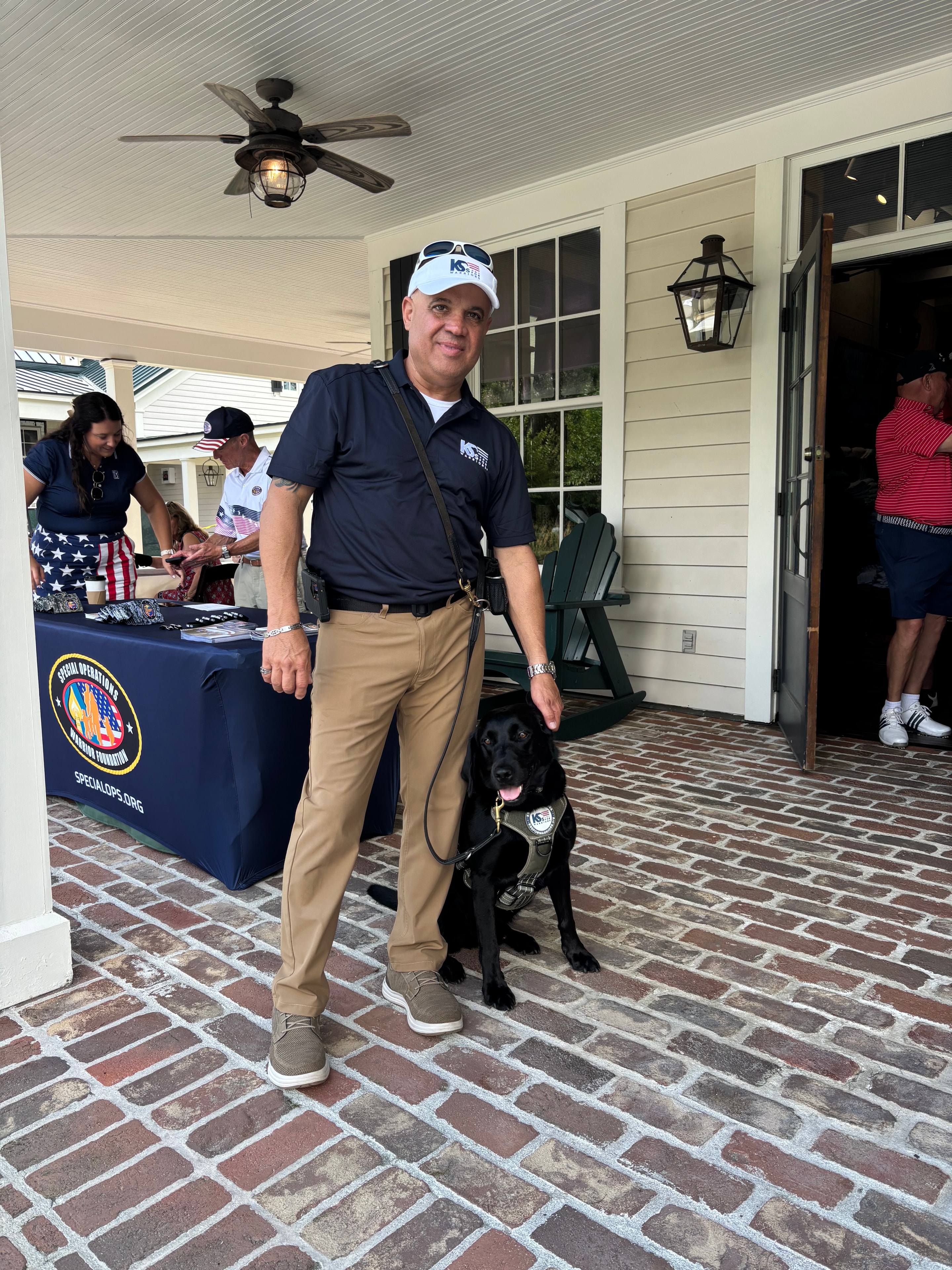 Wounded hero with service dog at the Oldfield Golf Classic